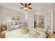 Cozy living room features stylish furniture, an area rug, and French doors leading to another room for seamless flow at 4844 Nellrose Nw Dr, Kennesaw, GA 30152