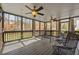 Relax on this spacious screened porch with ceiling fans and views of the landscaped backyard at 4844 Nellrose Nw Dr, Kennesaw, GA 30152