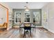 Dining area featuring wood floors, three windows and stylish furniture at 510 Mountainview Dr, Covington, GA 30016