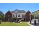 Large backyard with a fountain and a covered patio area perfect for entertaining at 5780 Warren Farm Sw Rd, Powder Springs, GA 30127