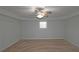 Unfinished basement space with neutral carpet, a ceiling fan and a window at 5780 Warren Farm Sw Rd, Powder Springs, GA 30127