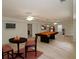 Spacious game room with a pool table, tv, and neutral carpet at 5780 Warren Farm Sw Rd, Powder Springs, GA 30127