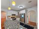 Bright kitchen featuring granite counters, stainless appliances, and tiled backsplash at 5780 Warren Farm Sw Rd, Powder Springs, GA 30127