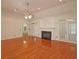 Spacious living room with a fireplace, hardwood floors, and french doors at 5780 Warren Farm Sw Rd, Powder Springs, GA 30127