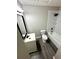 Modern bathroom features a sleek vanity, new toilet, and shower with sleek, black fixtures at 6061 Tina Ln, Rex, GA 30273