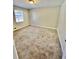 Carpeted bedroom with bright natural light from the window at 6061 Tina Ln, Rex, GA 30273