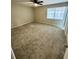 Spacious bedroom with plush carpeting and plenty of natural light from the window at 6061 Tina Ln, Rex, GA 30273