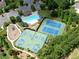 Aerial view of community amenities including pool, tennis, and basketball courts in lush surroundings at 472 Eagles Nest Cir, Auburn, GA 30011