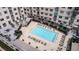 Aerial view of the community pool surrounded by lounge seating and lush landscaping at 805 Peachtree Ne St # 317, Atlanta, GA 30308
