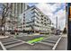 Corner condo building featuring modern architecture and streetscape view at 805 Peachtree Ne St # 317, Atlanta, GA 30308