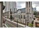 Church on the street with cityscape in the background and a view from a nearby building at 805 Peachtree Ne St # 317, Atlanta, GA 30308