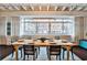 Bright dining room with a long table, seating for eight, and a large window offering natural light at 805 Peachtree Ne St # 317, Atlanta, GA 30308
