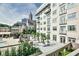 Exterior view featuring building architecture with balconies, landscaped terrace and city views at 805 Peachtree Ne St # 317, Atlanta, GA 30308