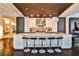 Modern kitchen with breakfast bar, white cabinetry, and stainless steel appliances at 805 Peachtree Ne St # 317, Atlanta, GA 30308