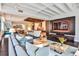 Spacious open-concept living room and kitchen with modern design, dark floors, and plenty of natural light at 805 Peachtree Ne St # 317, Atlanta, GA 30308