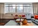 Bright living room with views of the city, comfortable seating, and stylish decor at 805 Peachtree Ne St # 317, Atlanta, GA 30308