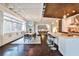 Open concept living space featuring kitchen, dining, and living areas with stainless steel appliances and hardwood floors at 805 Peachtree Ne St # 317, Atlanta, GA 30308