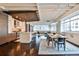 Spacious open-concept floor plan featuring kitchen, dining and living area with exposed beams and hardwood floors at 805 Peachtree Ne St # 317, Atlanta, GA 30308