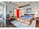 Comfortable bedroom with ensuite bathroom, exposed ceilings and industrial modern accents at 805 Peachtree Ne St # 317, Atlanta, GA 30308