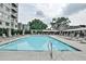 Outdoor pool with lounge chairs and shaded cabanas offers a resort-style experience at 805 Peachtree Ne St # 317, Atlanta, GA 30308