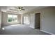 Bright and spacious bedroom with carpeted floors and plenty of natural light at 907 Southfork Dr, Loganville, GA 30052