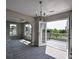 Open-plan living room featuring access to deck, neutral color palette, and abundant natural light at 907 Southfork Dr, Loganville, GA 30052