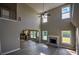 Open-concept living room featuring a fireplace, high ceilings, and plenty of natural light at 907 Southfork Dr, Loganville, GA 30052