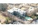 Aerial view of a modern condo building featuring a pool and ample parking at 130 Arizona Ne Ave # 106, Atlanta, GA 30307