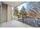 Spacious balcony with a glass railing offering unobstructed views of the landscape at 130 Arizona Ne Ave # 106, Atlanta, GA 30307