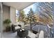Cozy balcony with comfortable seating and a beautiful view of the surrounding greenery at 130 Arizona Ne Ave # 106, Atlanta, GA 30307
