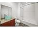 Bright bathroom with a glass bowl sink, shower-tub and white subway tile at 130 Arizona Ne Ave # 106, Atlanta, GA 30307