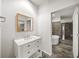 Modern bathroom with a marble vanity, soaking tub, and glass shower featuring sleek design at 130 Arizona Ne Ave # 106, Atlanta, GA 30307
