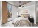 Cozy bedroom with a large window, concrete ceiling, and ample natural light at 130 Arizona Ne Ave # 106, Atlanta, GA 30307