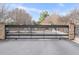 Secured entrance with stone pillars at Arizona Lofts, offering an exclusive community setting at 130 Arizona Ne Ave # 106, Atlanta, GA 30307