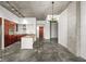 Open kitchen with modern cabinets, a stainless steel hood, and concrete floors at 130 Arizona Ne Ave # 106, Atlanta, GA 30307