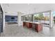 Open kitchen and living room combo with barstool seating, large windows, and stylish decor at 130 Arizona Ne Ave # 106, Atlanta, GA 30307