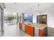 Modern kitchen with large island, granite countertops, stainless steel appliances, and a view of the dining space at 130 Arizona Ne Ave # 106, Atlanta, GA 30307