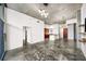 Spacious living room featuring an open floor plan, white walls, and polished concrete floors at 130 Arizona Ne Ave # 106, Atlanta, GA 30307