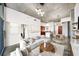 Open living room featuring a modern sofa, round wood table, and decorative lighting fixtures at 130 Arizona Ne Ave # 106, Atlanta, GA 30307