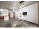 Open living room with concrete floors, dining area, and view into the kitchen at 130 Arizona Ne Ave # 106, Atlanta, GA 30307