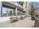 Outdoor patio with tables and chairs, perfect for grilling and entertaining guests in a communal setting at 130 Arizona Ne Ave # 106, Atlanta, GA 30307