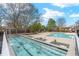 A multi-section pool with pristine blue water offers the perfect spot for relaxation and recreation at 130 Arizona Ne Ave # 106, Atlanta, GA 30307