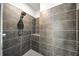 Modern tiled shower with a rainfall showerhead and built-in shelf for toiletries at 130 Arizona Ne Ave # 106, Atlanta, GA 30307