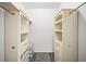 Bright walk-in closet featuring custom shelving and hanging rods for optimal organization at 130 Arizona Ne Ave # 106, Atlanta, GA 30307