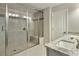 Modern bathroom with a glass-enclosed shower, granite countertop and a double sink at 1912 Townsend Ne Ct, Atlanta, GA 30329