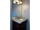 Bathroom featuring vanity with granite countertop and modern faucet at 500 Kings Pl, Riverdale, GA 30296