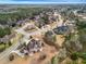 Community aerial showcasing manicured lawns, mature trees, and desirable home styles at 1069 Eagles Brooke Dr, Locust Grove, GA 30248