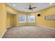 Bedroom with carpet flooring, two windows, and ceiling fan at 1069 Eagles Brooke Dr, Locust Grove, GA 30248