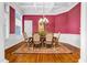 Dining room featuring coffered ceilings, hardwood floors, and natural light from large windows at 1069 Eagles Brooke Dr, Locust Grove, GA 30248