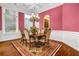 Dining room features hardwood floors, bright walls, and large windows at 1069 Eagles Brooke Dr, Locust Grove, GA 30248